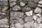 Abstract traditional stone wall pavement texture background. Bumpy textured stonewall made from flagstone and slabstone