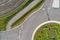 Abstract vertical aerial view of a cut roundabout next to an area of arable land