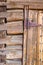 Abstract of Vintage Antique Log Cabin Wall and Door with Hinge.