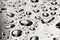 Abstract water drops on polished stainless steel surface