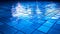 Abstract Water Reflections: Vibrant Blue Mosaic Tiles in Illuminated Indoor Swimming Pool