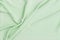 Abstract waving green fabric background