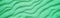 Abstract wavy sandy background. Green color toning.  Horizontal banner