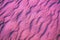 Abstract wavy sandy background. Purple color toning