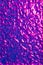 Abstract wavy surface with neon magenta and violet hues.