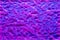 Abstract wavy surface with neon magenta and violet hues.