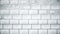 Abstract white bricks appear chaotically and forming a wall on grey background, monochrome. Animation. White rectangle