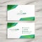 Abstract white business card with green shapes