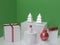 Abstract white christmas tree,metallic red ball white glossy snowman and gift box green background 3d render