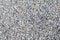 Abstract white crushed stones texture background. Gray rubble construction rock pebble pattern.