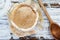 Abstract of Whole Wheat Sour Dough Starter over a White Wood Background