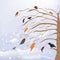 Abstract winter and autumnal landscape with snow -cover tree, birds, snow fall, leaf fall, snowdrifts, sky