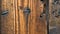 Abstract wooden antique background. Vintage door detail with nails, holes and cracks