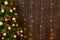 Abstract wooden background with christmas tree and lights, classic dark interior backdrop, copy space for text, winter holiday con