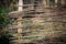 Abstract wooden wattle fense in autumn garden