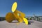 A abstract yellow metal sculpture