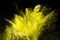 Abstract yellow powder explosion