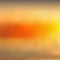 Abstract yellowish orange blurred background, sunset sky