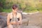 Abstract Young woman in casual style fashion siting on the beach