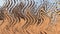 Abstract zigzag pattern with waves in sandy, brown, blue tones. Artistic image processing created by photo of mountain desert land