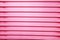 Abstraction background. Vertical bright stripes of plastic trays stacked in different colors, structures