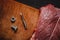 Abstraction. Combination of various textures and objects. A piece of raw meat, a tapping tap, a bolt and a nut.