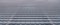 Abstraction of industrial wall from factory plant infrastructure object blurred panoramic format picture gray neutral color