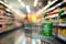An abstractly blurred grocery store aisle with an unoccupied green cart