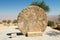 The Abu badd, rolling stone used as a door to the Byzantine Monastery at Mount Nebo, Jordan.