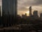 Abu Dhabi city skyline against epic clouds and World Trade Center Towers