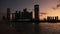 Abu Dhabi cityscape, Al Reem island at sunset, buildings silhouettes against sky