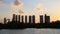 Abu Dhabi cityscape, Al Reem island at sunset, buildings silhouettes against sky