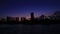 Abu Dhabi cityscape, Al Reem island after the sunset, buildings silhouettes against sky