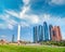 Abu Dhabi modern skyline from Emirates Palace Gardens on a sunny