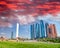 Abu Dhabi modern skyline from Emirates Palace Gardens on a sunny