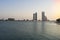 Abu Dhabi skyline financial district over the water at sunset