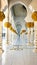 Abu Dhabi, UAE - March, 2020: White marble columns and arcades of the world famous Sheikh zayed grand mosque