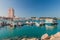 ABU DHABI, UAE - MARCH 7, 2017: Boats in Marina Breakwater, United Arab Emirates. Fairmont Marina Residences building in the