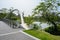 Abutment of tied bridge over water in city of sunny summer morning