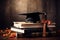 Academic achievement mortarboard, diploma, and book adorn the table