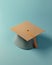 Academic Simplicity: Top View of College Graduation Hat on Bright Green Background