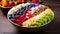 Acai bowl with strawberries, banana, blueberries, kiwi fruit, nuts and granola on wooden table. Nourishing breakfast full of