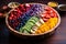 Acai bowl with strawberries, banana, blueberries, kiwi, mango and oats on wooden table. Nourishing breakfast full of vitamins,