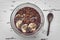 Acai smoothie breakfast bowl with sliced bananas toppings, chia seeds and granola recipe. Healthy frozen snack treat top