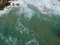 Acapulco Pacific Ocean waves in stones near beach from above