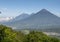 acatenango volcano with two peaks left and Fuego volcano right