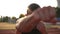 Accelerated handhelded footage of a young boxer exercising outdoors. Portrait of a man boxing with invisible opponent