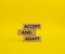 Accept or adapt symbol. Wooden blocks with words Accept and adapt. Beautiful yellow background. Business and Accept and adapt