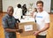 We accept any and all donations. Cropped portrait of two volunteers carrying a donations box.