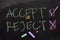 Accept or Reject written with color chalk concept on the blackboard